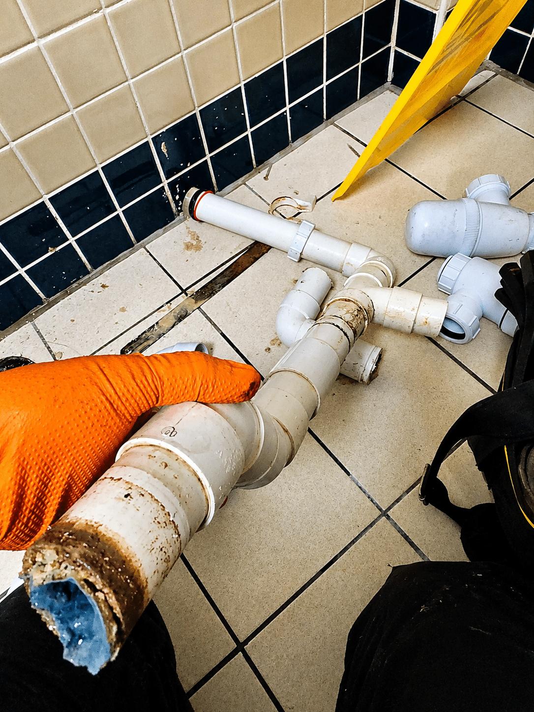 Emergency plumber in Kilmainham replacing a worn sink trap and leaking waste pipe