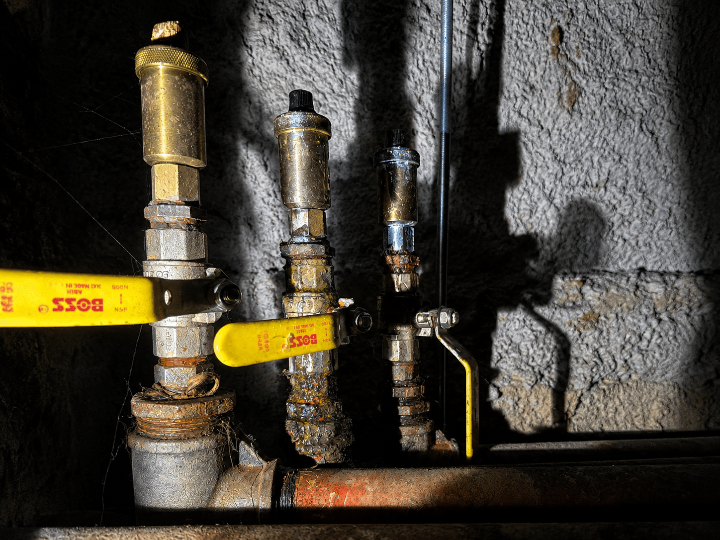 Emergency plumber in Portobello replacing corroded automatic air vents and valves on hot water pipework