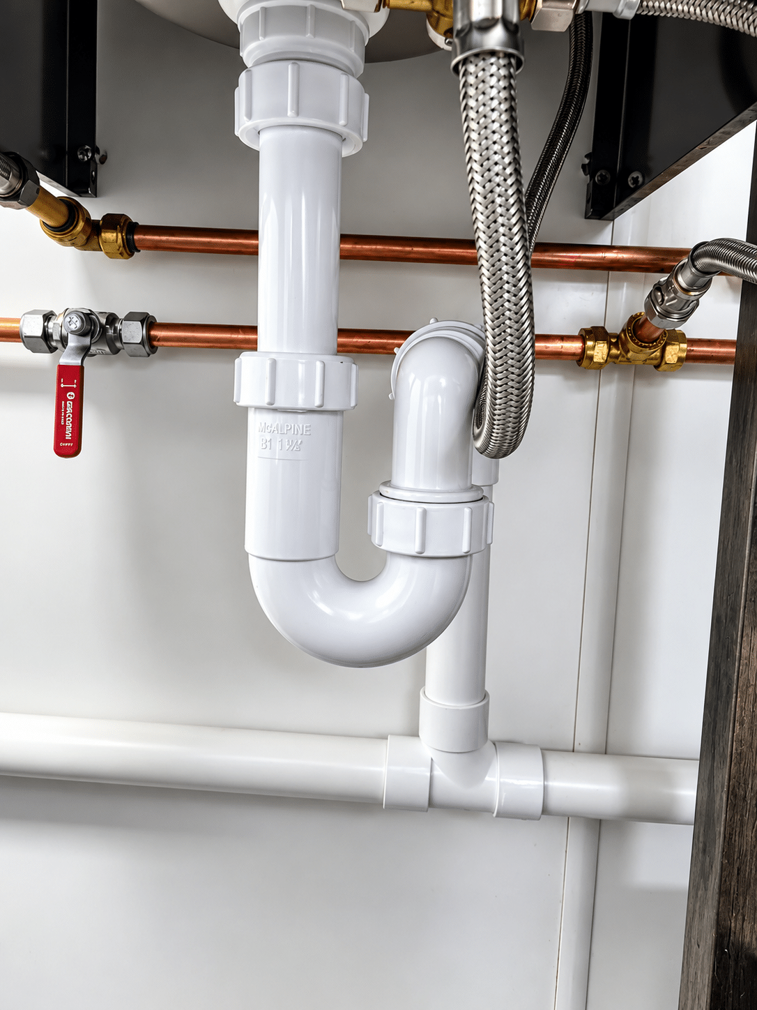 New water supply, isolating valve and waste trap fitted for a café coffee machine by an emergency plumber in Blackrock
