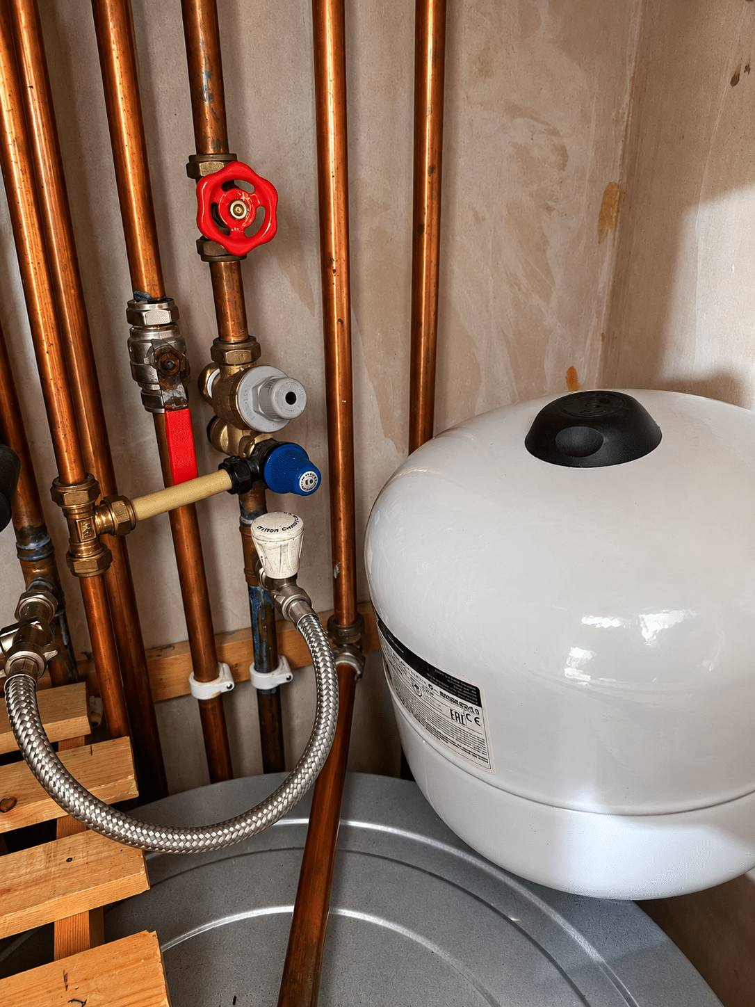 Emergency plumber in Lucan fixing a leak under a kitchen sink