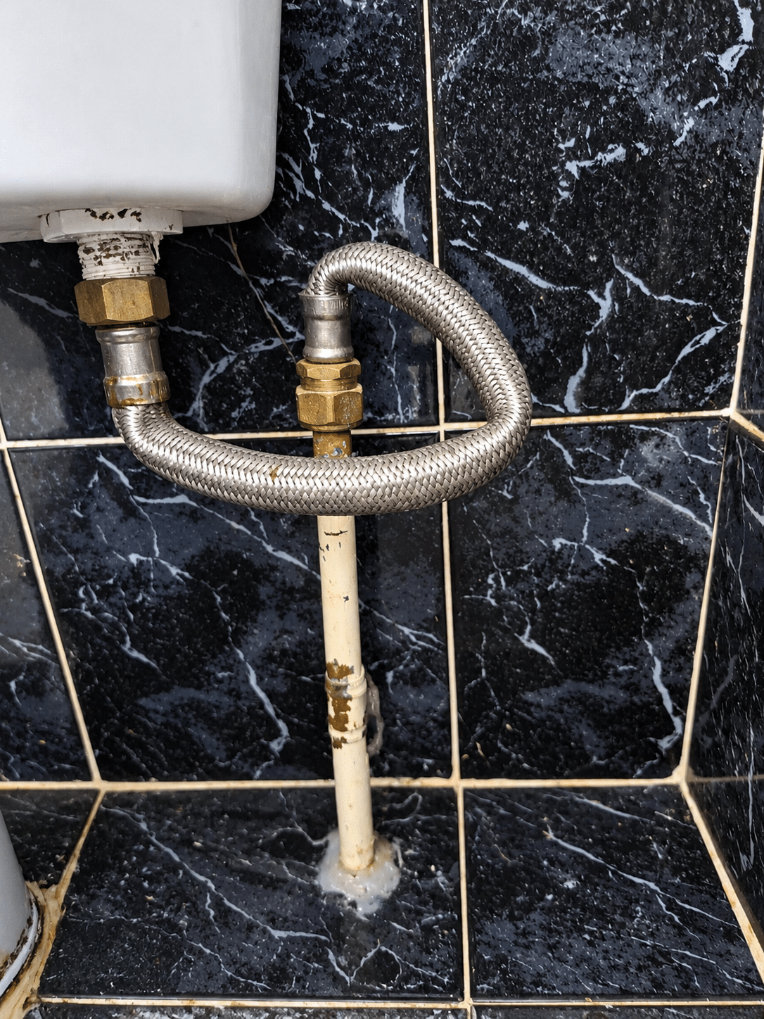 Emergency plumber in Terenure repairing a leaking toilet cistern